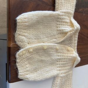 Vintage hand crocheted infant sweater.